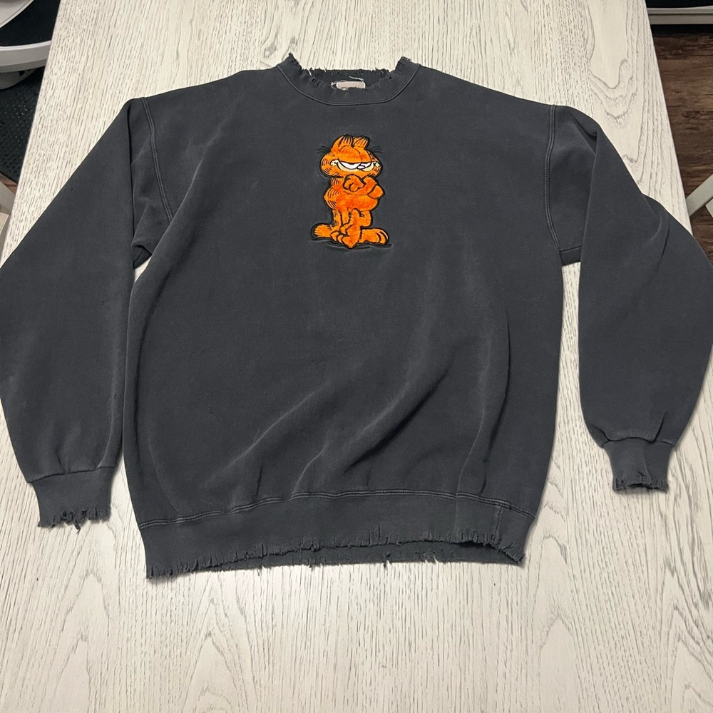 Black and Orange Crewneck Sweater with Cartoon Graphic